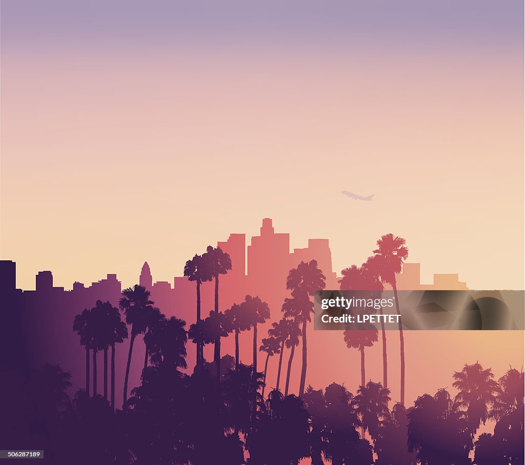 Escena del atardecer de Los Angeles con palmeras
