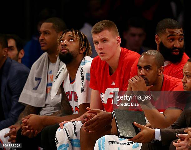Carmelo Anthony,Derrick Williams,Kristaps Porzingis and Arron Afflalo of the New York Knicks look on from the bench in the final minutes of the game...
