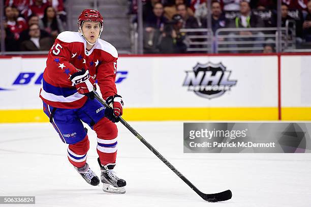 Aaron Ness of the Washington Capitals controls the puck in the third period against the New York Rangers during a game at Verizon Center on January...