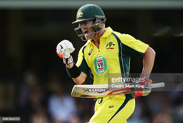 David Warner of Australia celebrates scoring a century during game five of the Commonwealth Bank One Day Series match between Australia and India at...