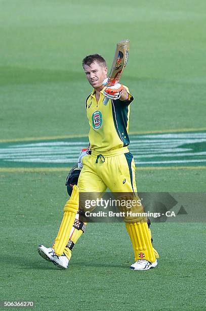 David Warner of Australia celebrates scoring his century during game five of the Commonwealth Bank One Day Series match between Australia and India...