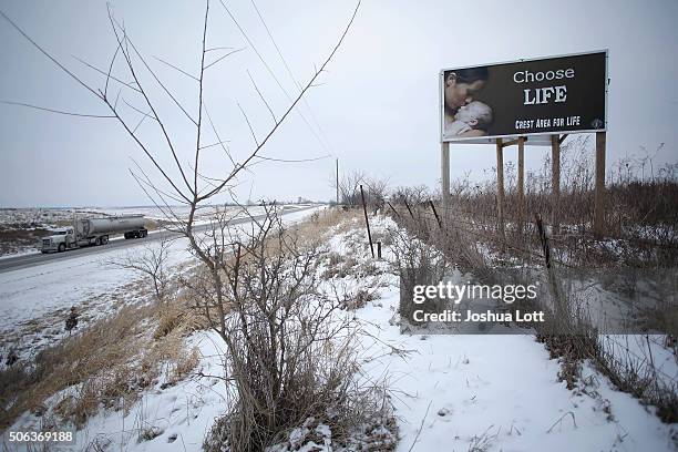 Chose Life" advertisement is displayed along a snow covered U.S. Highway 34 on January 22, 2016 in Thayer, Iowa. Presidential candidates seeking the...