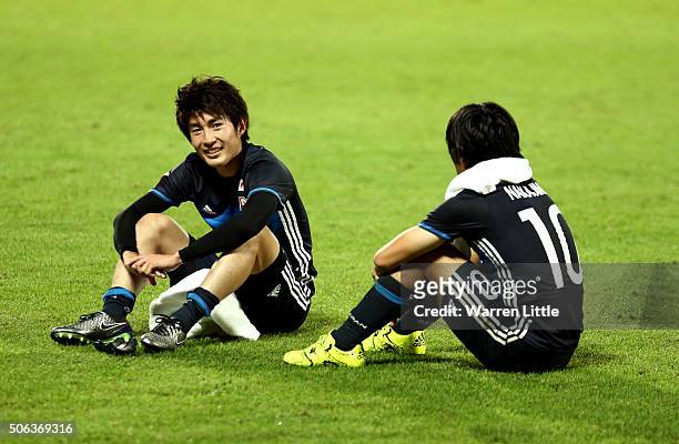 Yuta Toyokawa and Shoya Nakajima of Japan sit together after the AFC U-23 Championship quarter final match between Japan and Iran at the Abdullah Bin...
