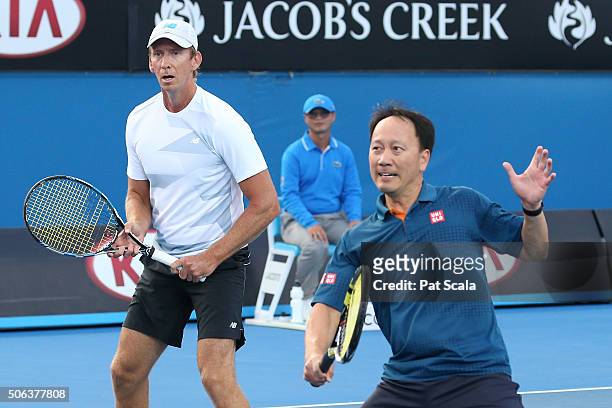 Wayne Arthurs of Australia and Michael Chang of the United States compete in their third round match against Jonas Bjorkman of Sweden and Thomas...