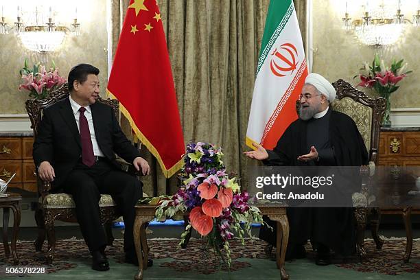 Chinese President Xi Jinping and Iranian President Hassan Rouhani pose during a meeting at Saadabad Palace in Tehran, Iran on January 23, 2016.