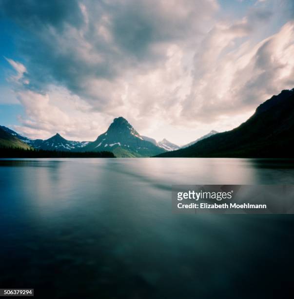 two medicine lake, glacier national park - two medicine lake montana stock pictures, royalty-free photos & images