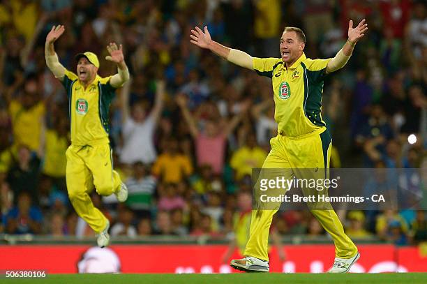 John Hastings of Australia celebrates taking the wicket of Rohit Sharma of India during game five of the Commonwealth Bank One Day Series match...