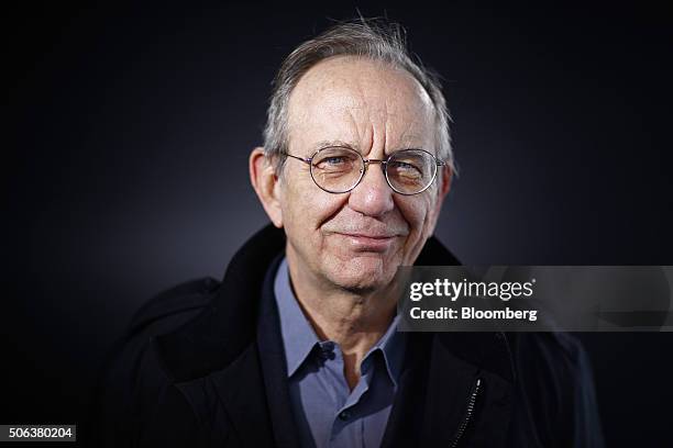 Pier Carlo Padoan, Italy's finance minister, poses for a photograph following a Bloomberg Television interview at the World Economic Forum in Davos,...