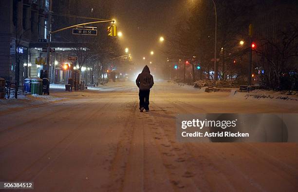 Pedestrian walks in the snow on Broadway at West 81st street on January 23, 2016 in New York City. A major Nor'easter is hitting much of the East...