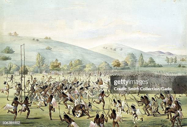 Native Americans in a large group playing an early version of the game lacrosse, 1888. From the New York Public Library. .