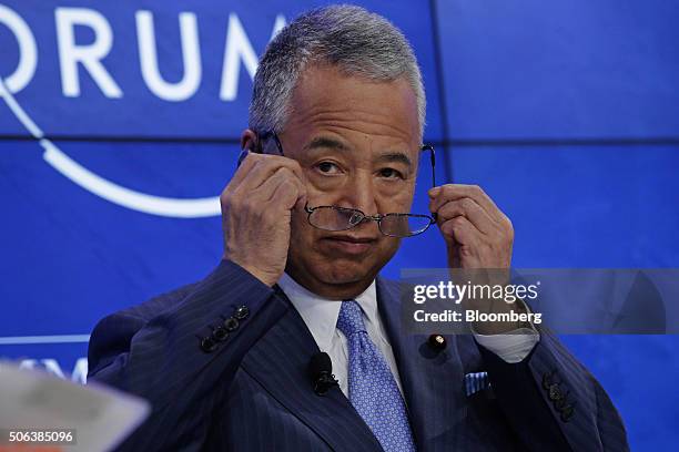 Akira Amari, Japan's economy minister, prepares for a panel session at the World Economic Forum in Davos, Switzerland, on Saturday, Jan. 23, 2016....