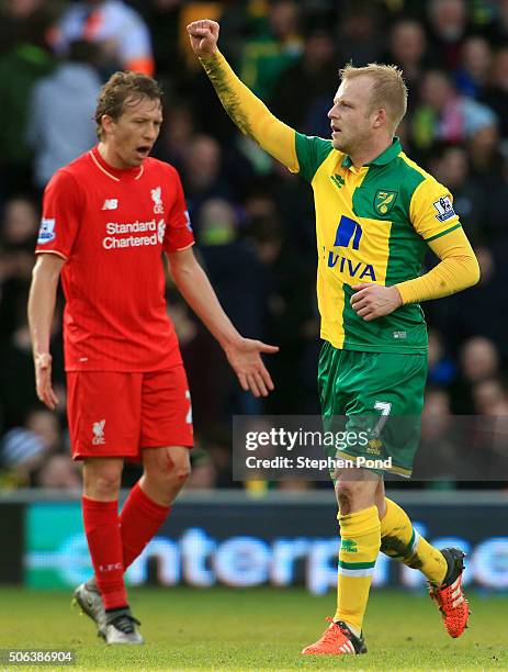 Steven Naismith of Norwich City celebrates scoring his team's second goal during the Barclays Premier League match between Norwich City and Liverpool...