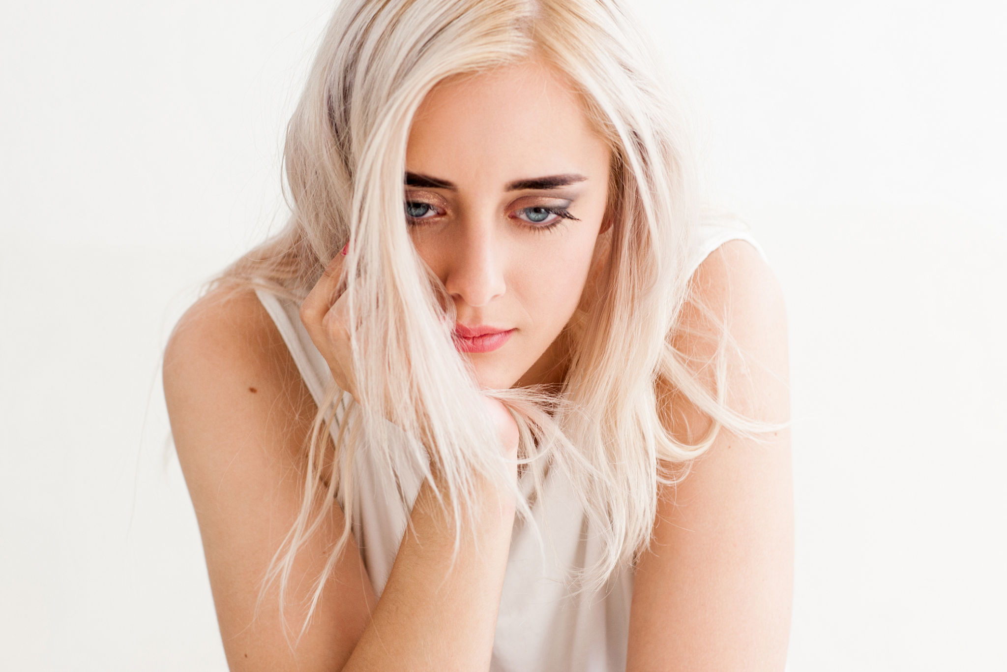 Sad lonely woman looking down in disappointment Sad lonely woman looking down in disappointment