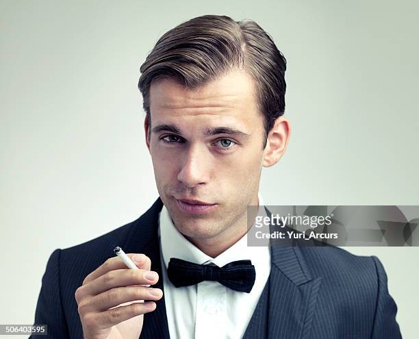he's a man of sophistication - cigarette smoking stockfoto's en -beelden