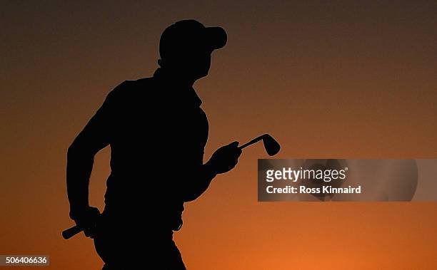 Rory McIlroy of Northern Ireland plays his second shot on the par four 9th hole during the third round of the Abu Dhabi HSBC Golf Championship at the...