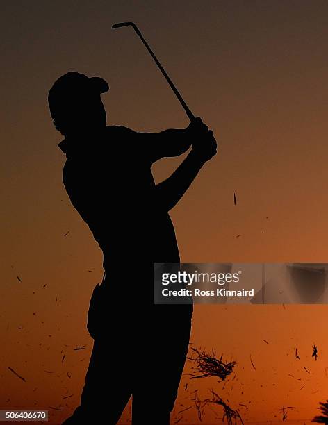 Rory McIlroy of Northern Ireland plays his second shot on the par four 9th hole during the third round of the Abu Dhabi HSBC Golf Championship at the...