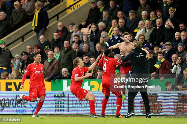 Adam Lallana of Liverpool ceelbrates scoring his team's fifth goal with his manager Jurgen Klopp and team mate Kolo Toure , Lucas Leiva and Roberto...