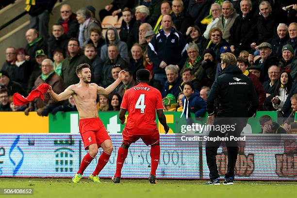 Adam Lallana of Liverpool ceelbrates scoring his team's fifth goal with his manager Jurgen Klopp and team mate Kolo Toure during the Barclays Premier...