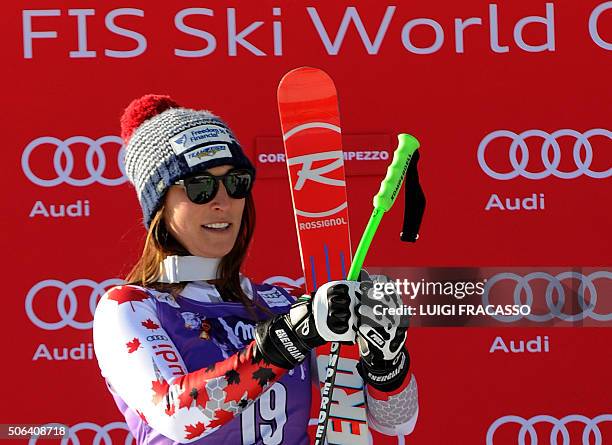 Canada's Larisa Yurkiw, placed second, poses on the podium of the FIS Alpine Skiing World Cup women's Downhill on January 23, 2016 in Cortina...