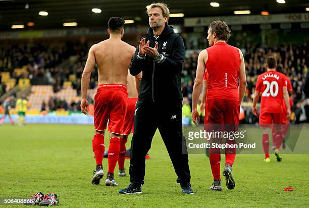 Jurgen Klopp, manager of Liverpool applauds the away supporters after his team's 5-4 win in the Barclays Premier League match between Norwich City...