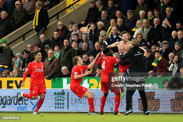 Adam Lallana of Liverpool ceelbrates scoring his team's fifth goal with his manager Jurgen Klopp and team mate Kolo Toure , Lucas Leiva and Roberto...