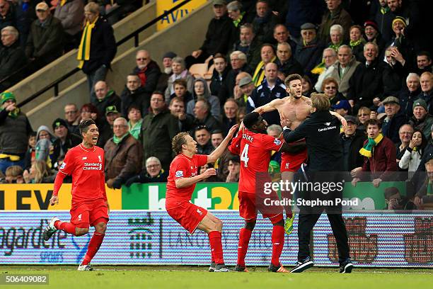 Adam Lallana of Liverpool ceelbrates scoring his team's fifth goal with his manager Jurgen Klopp and team mate Kolo Toure , Lucas Leiva and Roberto...