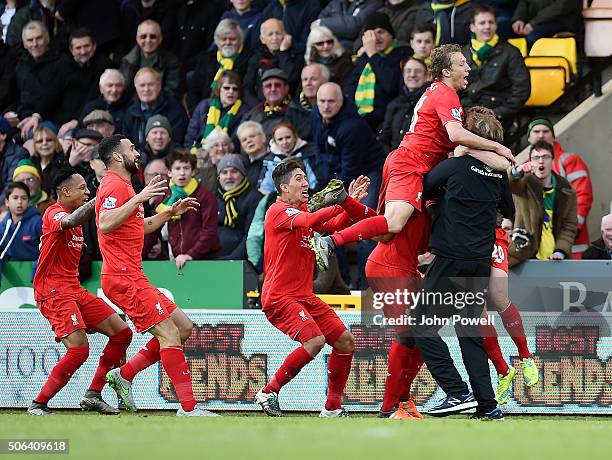 Adam Lallana of Liverpool celebrates with Jurgen Klopp manager of Liverpool and all his team mates during the Barclays Premier League match between...