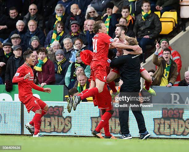 Adam Lallana of Liverpool celebrates with Jurgen Klopp manager of Liverpool and all his team mates during the Barclays Premier League match between...