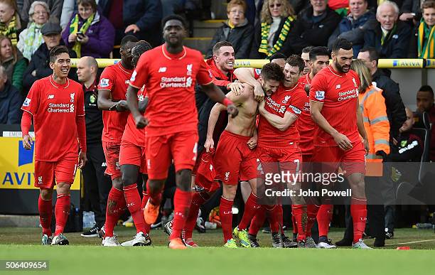 Adam Lallana of Liverpool celebrates with Jurgen Klopp manager of Liverpool and all his team mates during the Barclays Premier League match between...