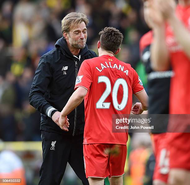 Jurgen Klopp manager of Liverpool embraces Adam Lallana of Liverpool at the end of the Barclays Premier League match between Norwich City and...