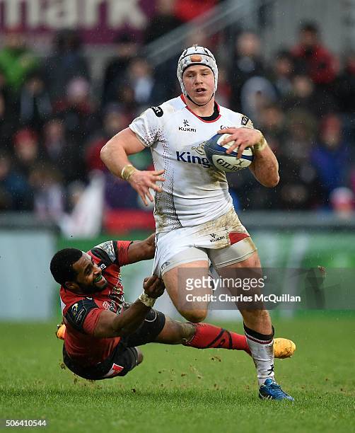 Luke Marshall of Ulster is tackled by Daniel Ikpefan of Oyonnax during the European Champions Cup Pool 1 round 6 game between Ulster and Oyonnax at...