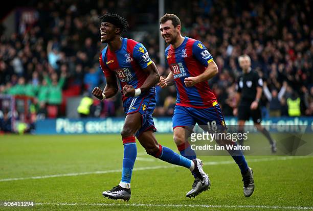 Wilfried Zaha and James McArthur of Crystal Palace celebrate their first goal own goal by Jan Vertonghen of Tottenham Hotspur during the Barclays...