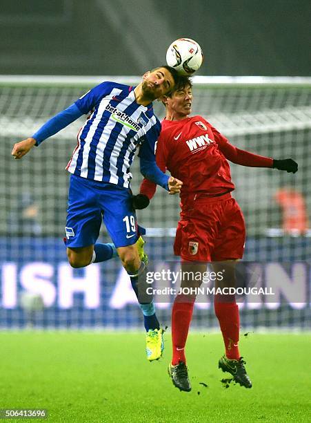 Hertha's Bosnian forward Vedad Ibisevic and Augsburg's South Korean defender Jeong-Ho Hong vie during the German first division football Bundesliga...