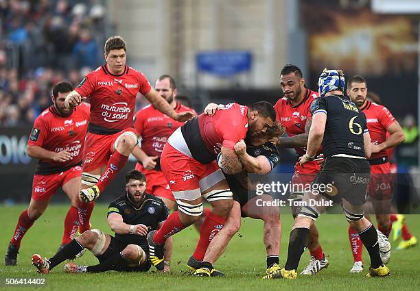 Romain Taofifenua of RC Toulon is tackled by Nick Auterac of Bath Rugby during the European Rugby Champions Cup match between Bath Rugby and RC...