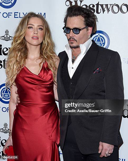 Actors Amber Heard and Johnny Depp attend Art of Elysium's 9th Annual Heaven Gala at 3LABS on January 9, 2016 in Culver City, California