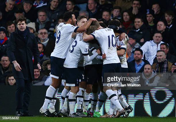Dele Alli of Tottenham Hotspur celebrates scoring his team's second goal with his team mates and Mauricio Pochettino during the Barclays Premier...