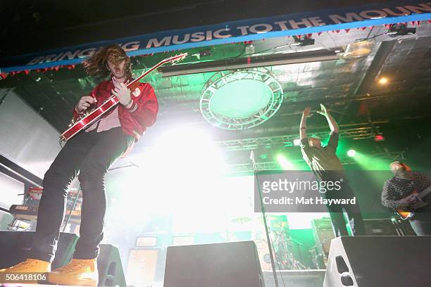 Nick Bockrath, Matthew Shultz and Brad Shultz of Cage The Elephant perform on stage at the Billboard Winterfest at Park City Live! on January 22,...
