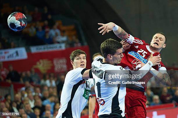 Szabolcs Zubai of Hungary and Erik Schmidt of Germany during the 2 group match of the EHF European Men's Handball Championship between Germany and...