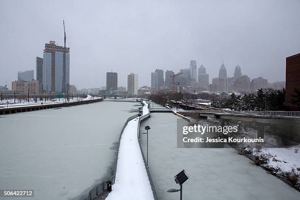 View of the Schuylkill river as snow continues to fall on January 23, 2016 in Philadelphia, Pennsylvania. The city, which announced a snow emergency,...