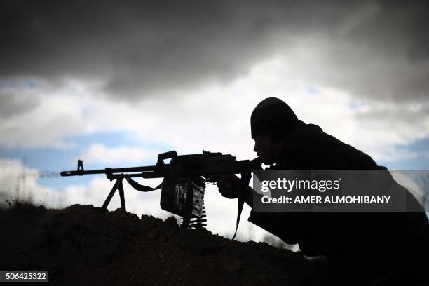 Fighter from Jaish al-Islam , the foremost rebel group in Damascus province who fiercely oppose to both the regime and the Islamic State group, holds...