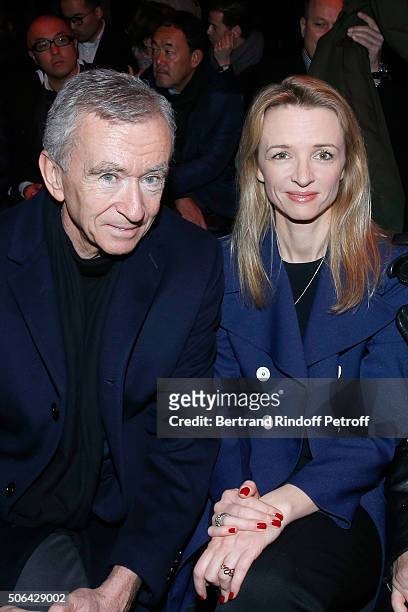 Owner of LVMH Luxury Group Bernard Arnault and his daughter Louis Vuitton's executive vice president, Delphine Arnault attend the Dior Homme Menswear...