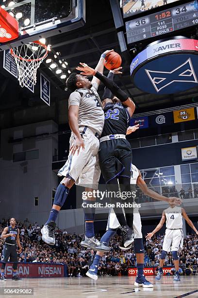 James Farr of the Xavier Musketeers blocks a shot by Derrick Gordon of the Seton Hall Pirates in the first half of the game at Cintas Center on...