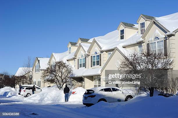 men clearing snow from driveway - montgomery county pennsylvania stock pictures, royalty-free photos & images