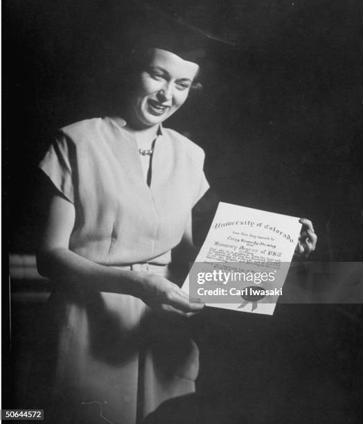 Mrs. Terry Kennedy Fleming accepting a certificate during a ceremony for the wives of graduates of the University of Colorado.