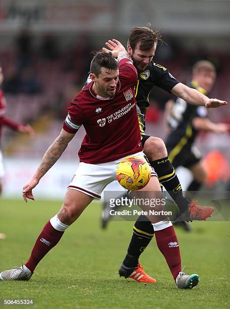 Marc Richards of Northampton Town controls the ball under pressure from Laurence Wilson of Morecambe during the Sky Bet League Two match between...
