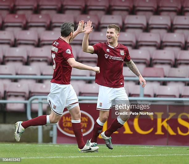 James Collins of Northampton Town celebrates after scoring his sides first goal with team mate Zander Diamond during the Sky Bet League Two match...