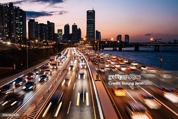 traffic on the seoul olympic expressway - illuminated bridge stock pictures, royalty-free photos & images