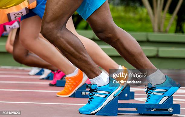 athletes ready to run - sprinter stock pictures, royalty-free photos & images