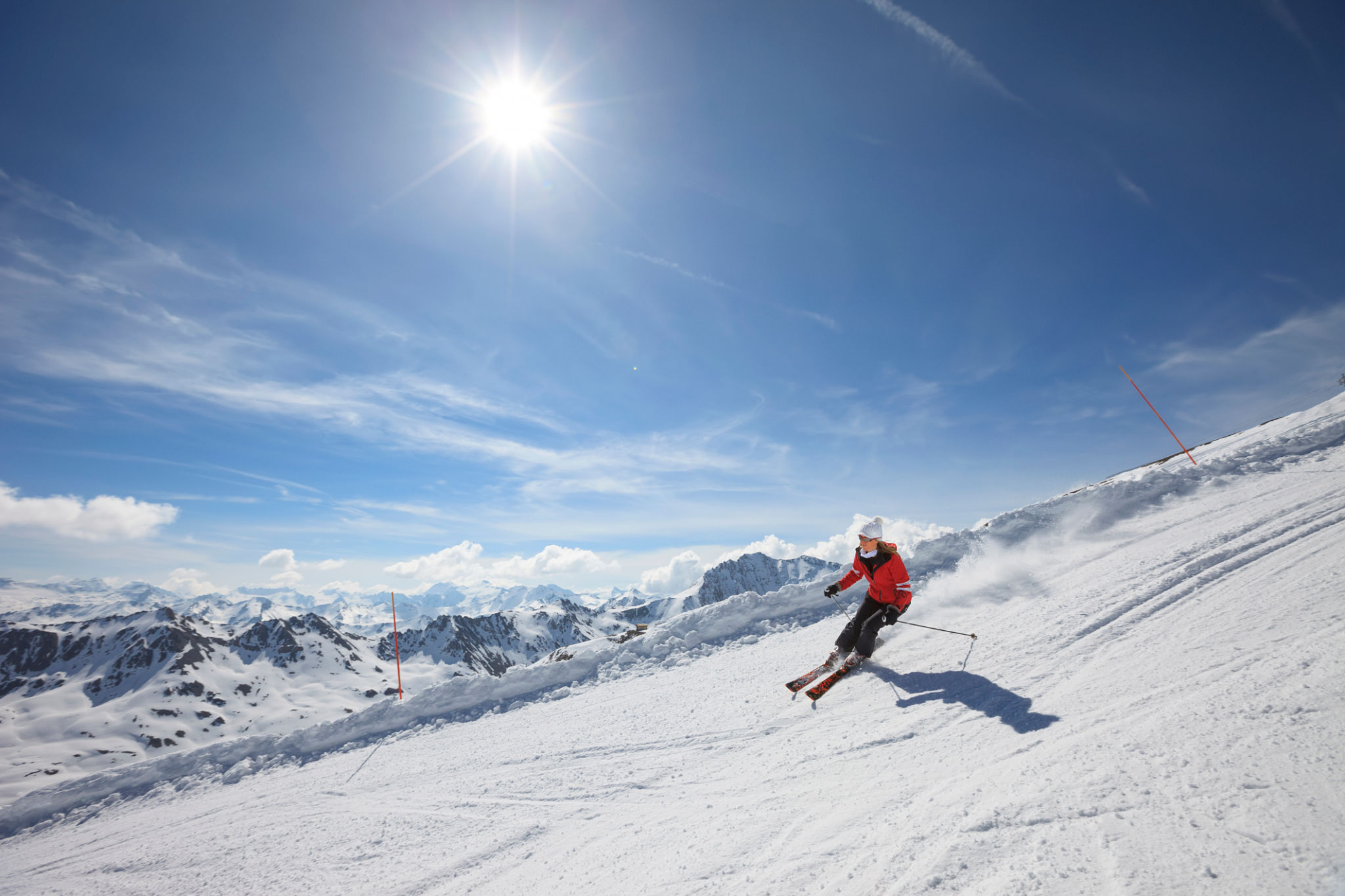 Mid adult women snow skier skiing on sunny ski resorts Mid adult women snow skier skiing on sunny ski resorts