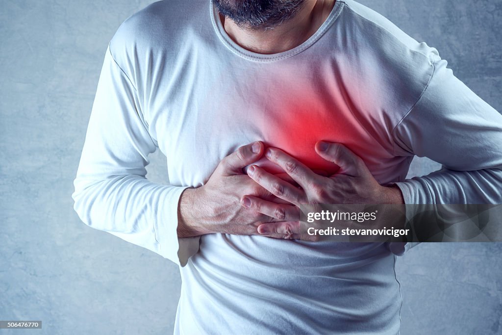 Severe heartache, man suffering from chest pain, having painful